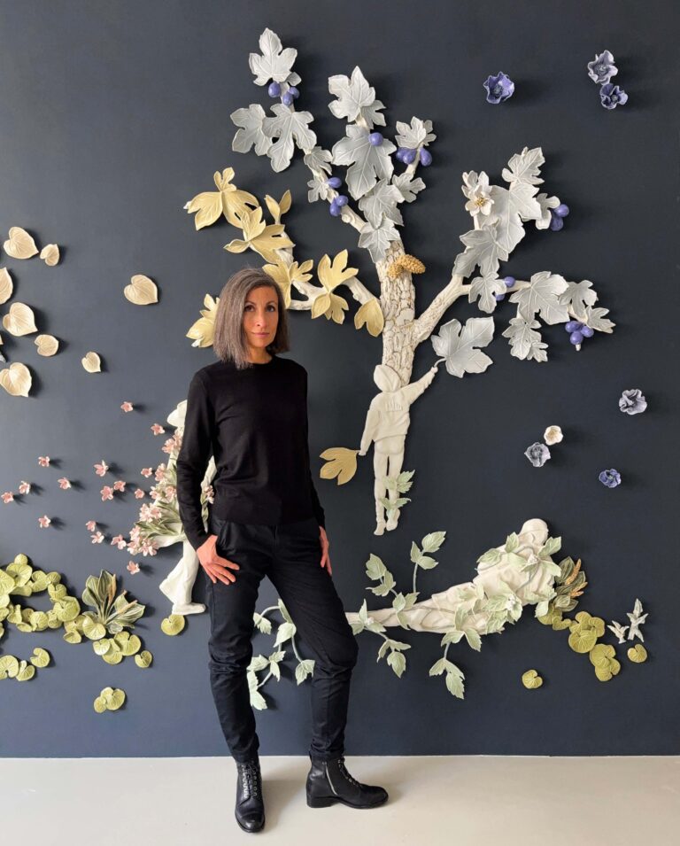 French artist Alice Riehl in front ozone of her porcelain wall installations